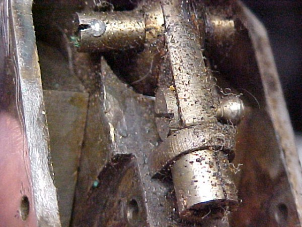 Different style split nut on the bottom of the spindle w/o any set screw and you can see the spanner nut on the end of the yoke screw on the right side.