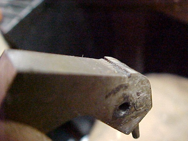 Left hammer sear notch packed full of crud, just as it came out of the gun.